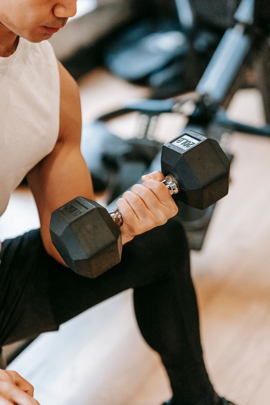 Client curling a dumbbell during a training session